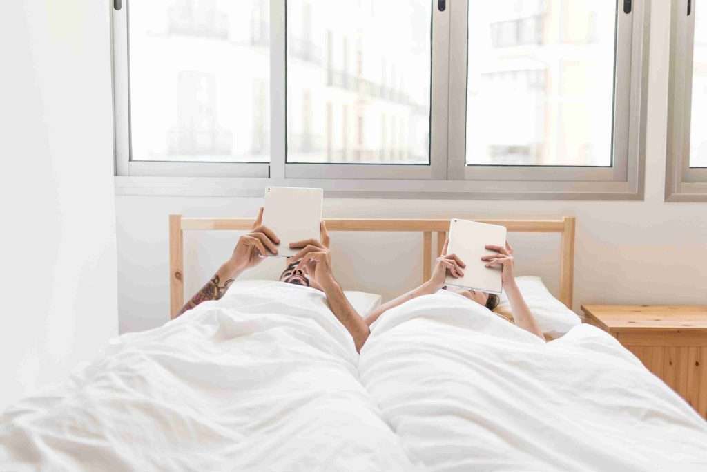couple relaxing in bed