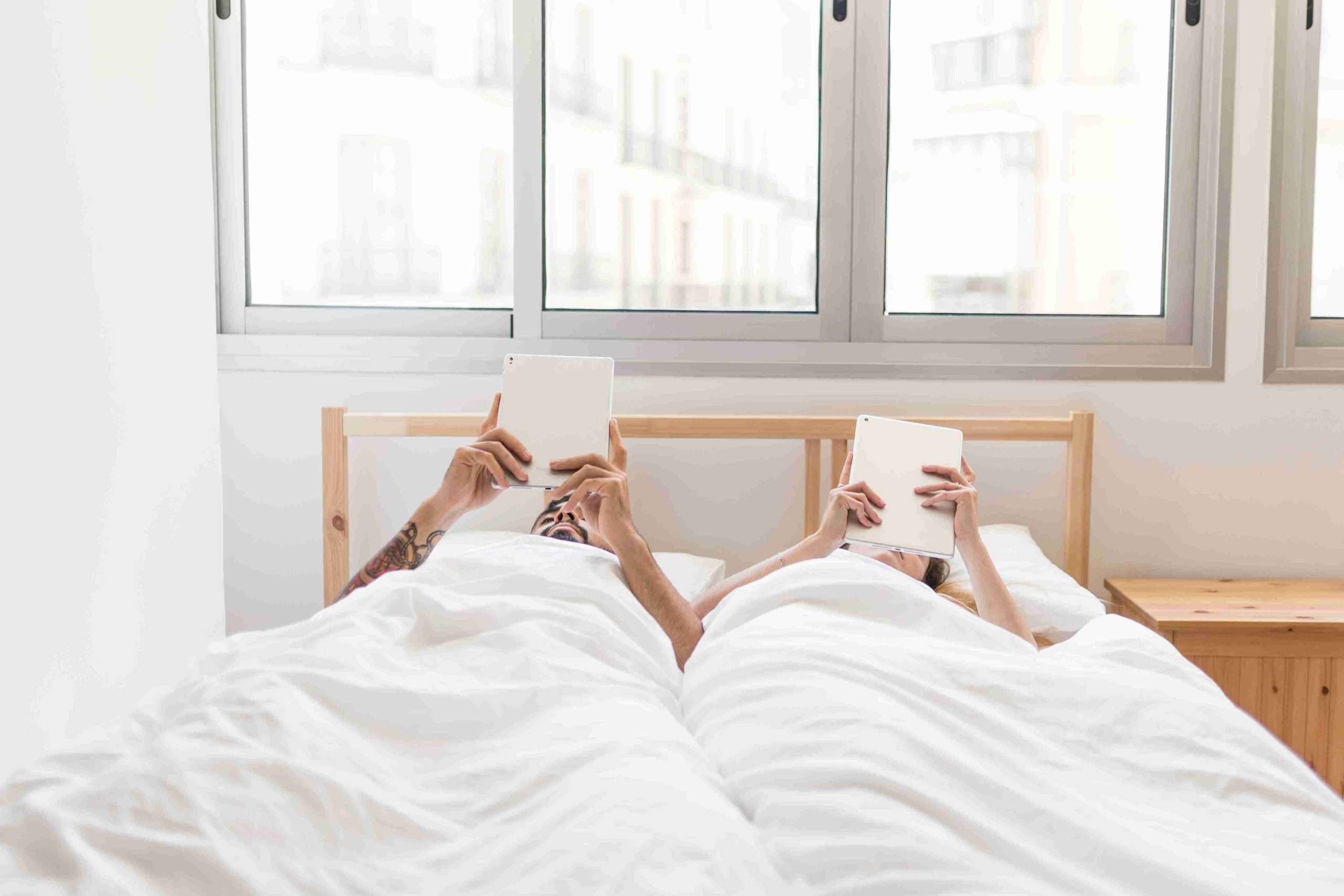 couple relaxing in bed