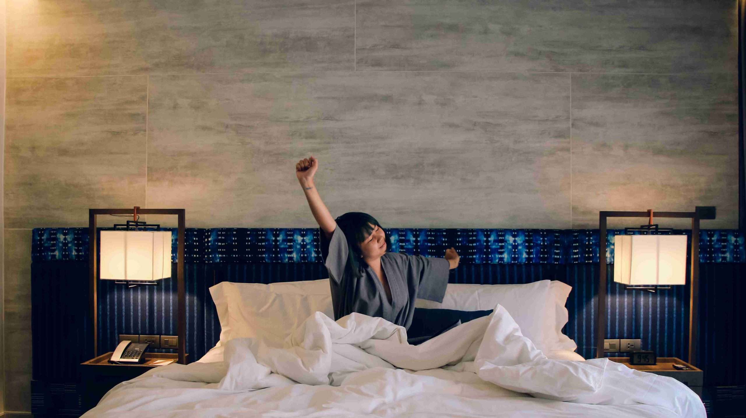 person waking up in bed