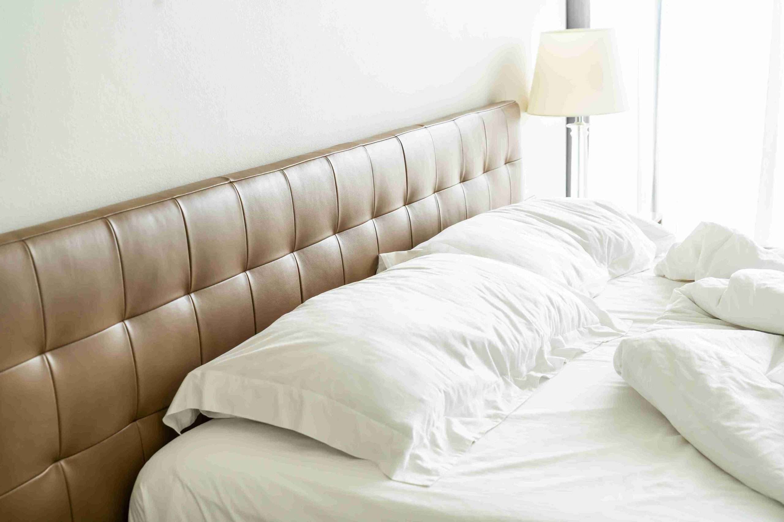 close-up of upholstered bed headboard