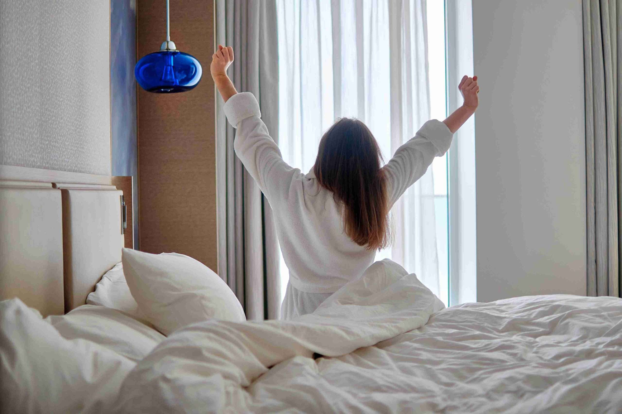 person waking up in adjustable bed