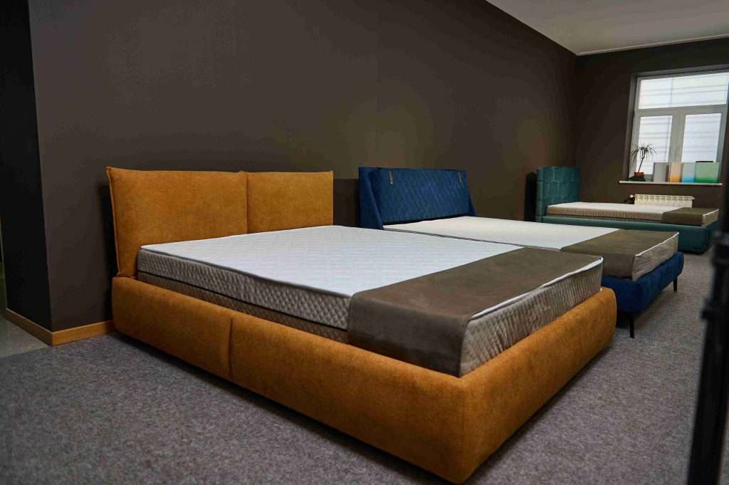 upholstered beds in furniture showroom