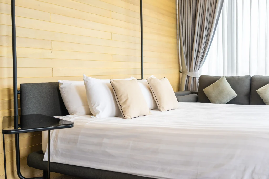 bed with white tufted headboard