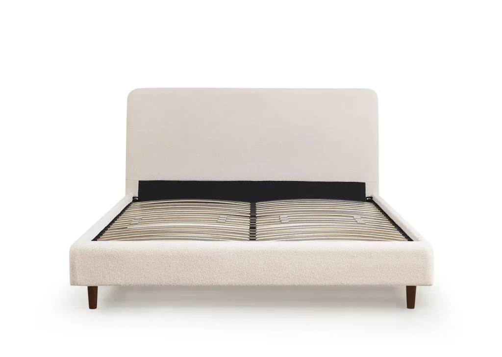 white upholstered bed with dark inset headboard