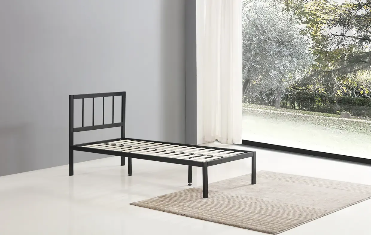 black metal bed frame with headboard in bedroom