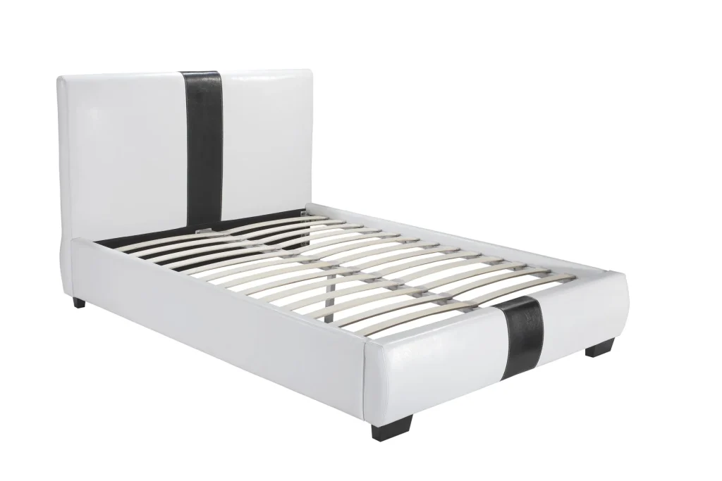 white upholstered bed with black stripe headboard
